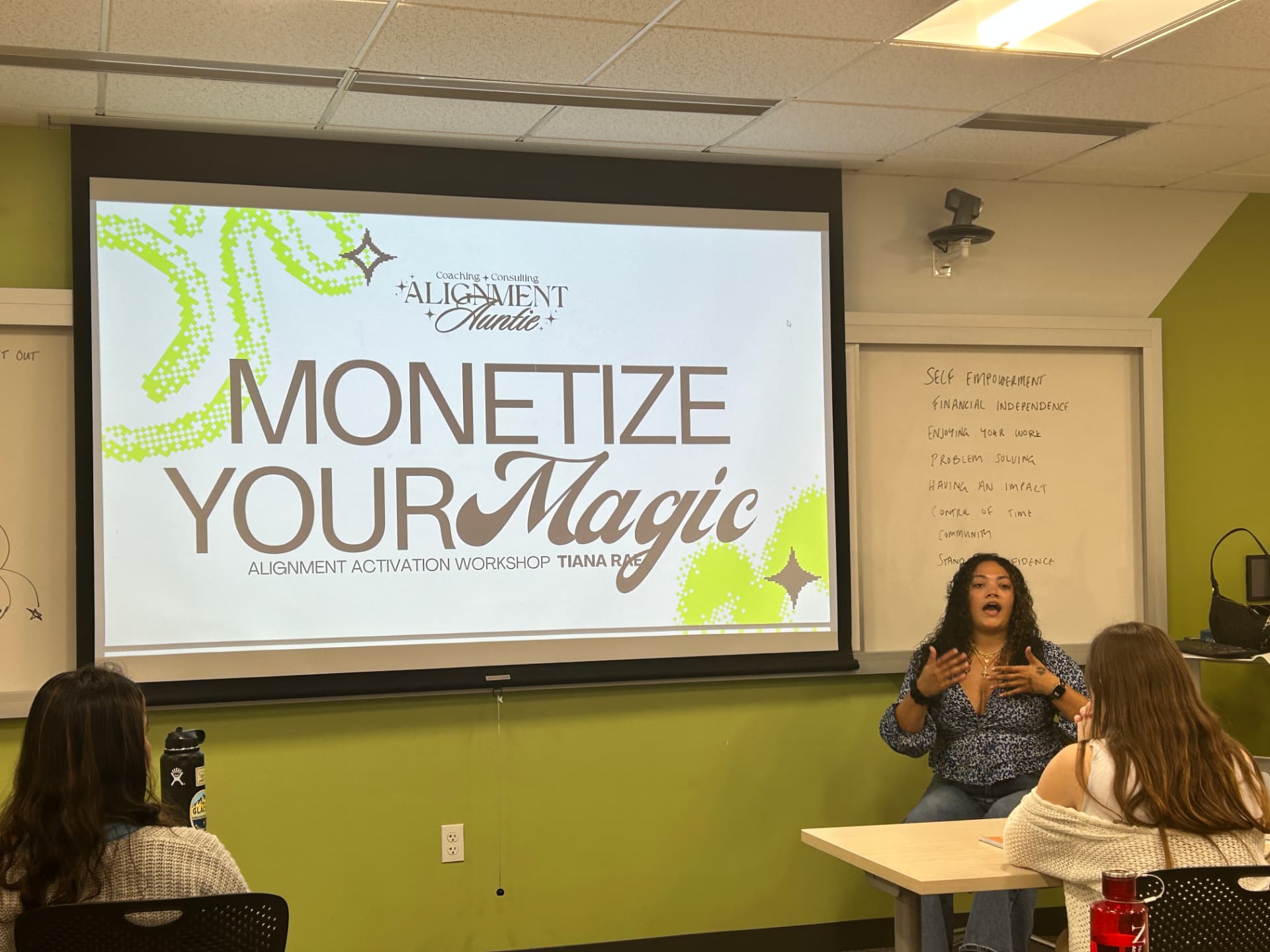 Tiana leading the Monetize Your Magic workshop for a seated group