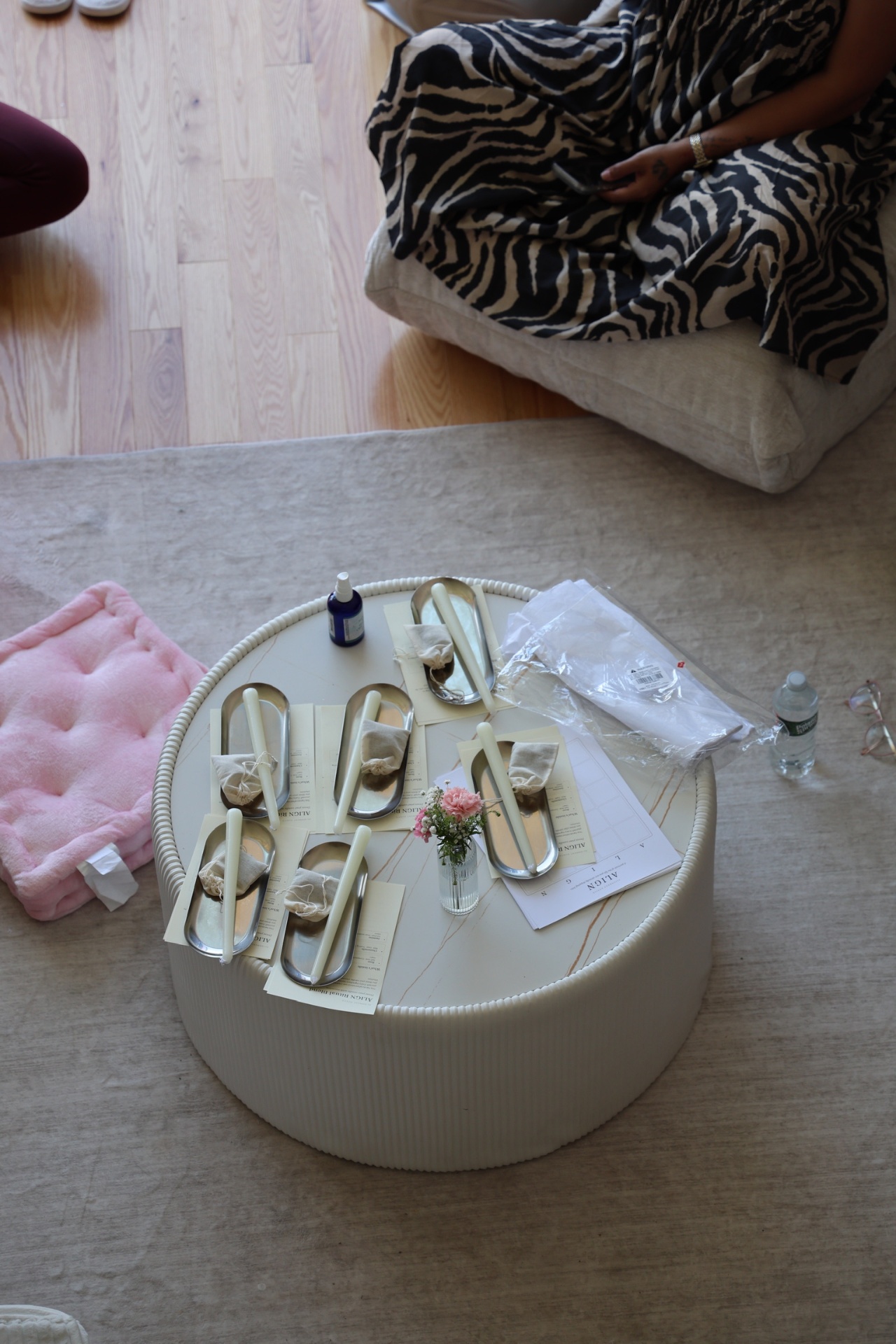 A ritual table set with candles and cards during a workshop