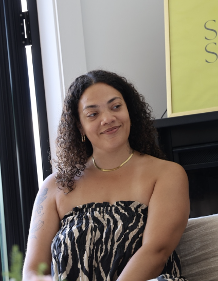 Tiana, founder of Alignment Auntie, in soft daylight